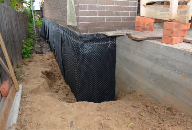 SJ Waterproofing Pros technician performing targeted Vapor Barrier Installation assessment in Fountain City, IN